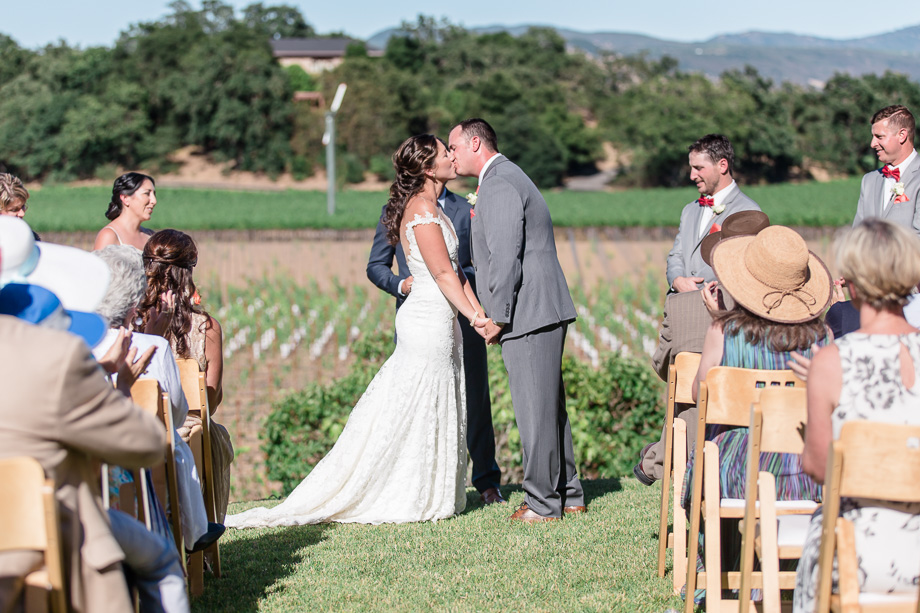 newlywed shared their first kiss in front of their friends and family