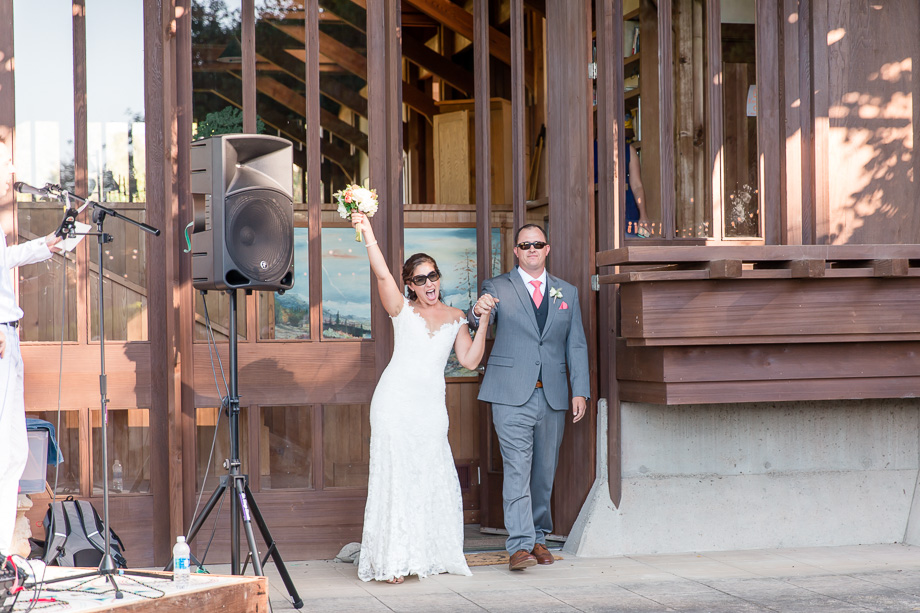 bride and groom walking out of this building that was designed by John Marsh Davis