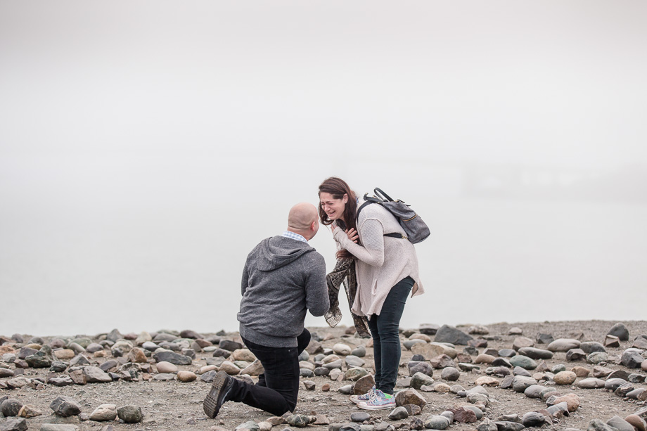 emotional moment at a foggy san francisco proposal