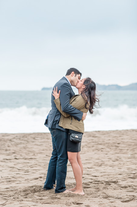 a kiss by the ocean after the beach proposal