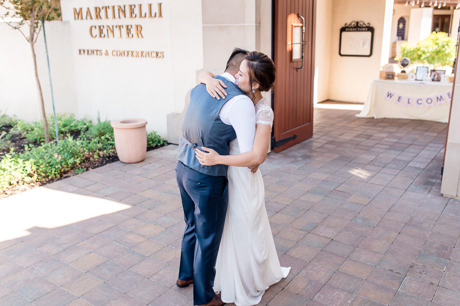 an emotional wedding first look in front of their beautiful winery venue