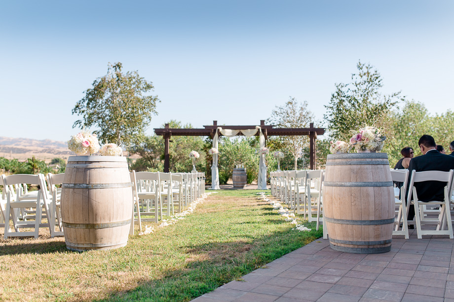 winery wedding ceremony site with wine barrels