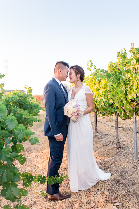 bride and groom portrait in the vineyards at Martinelli Event Center