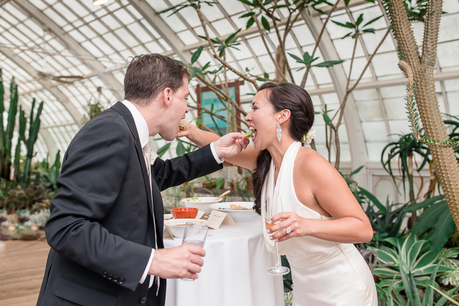 bride and groom feeding each other nachos instead of a traditional wedding cake