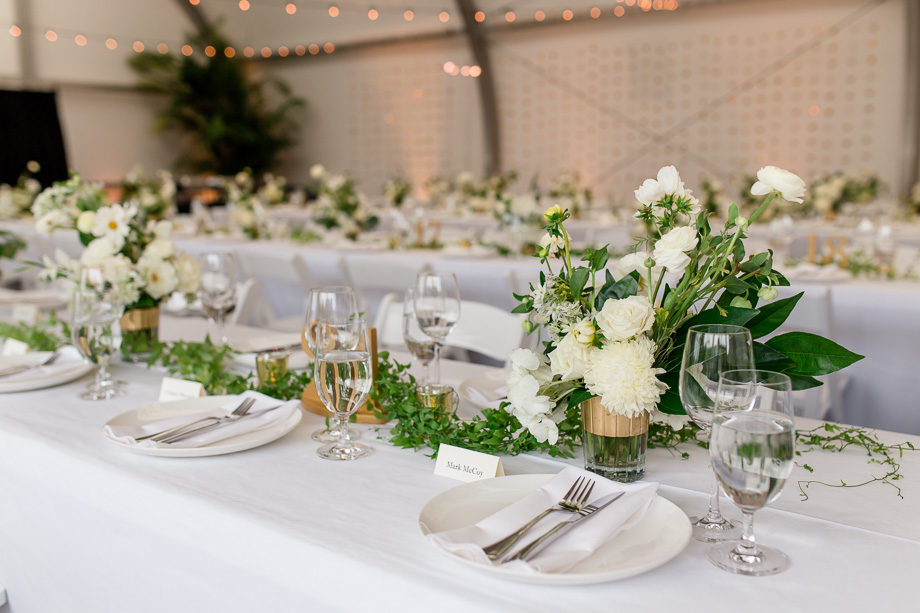 the conservatory of flowers is transformed into this elegant and romantic reception hall with these beautiful centerpieces