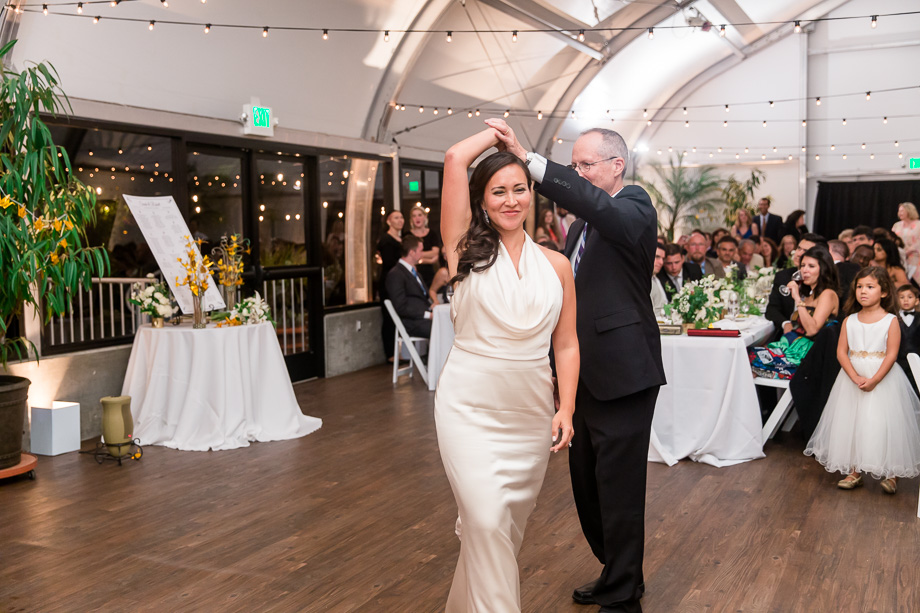 bride dancing with her proud dad