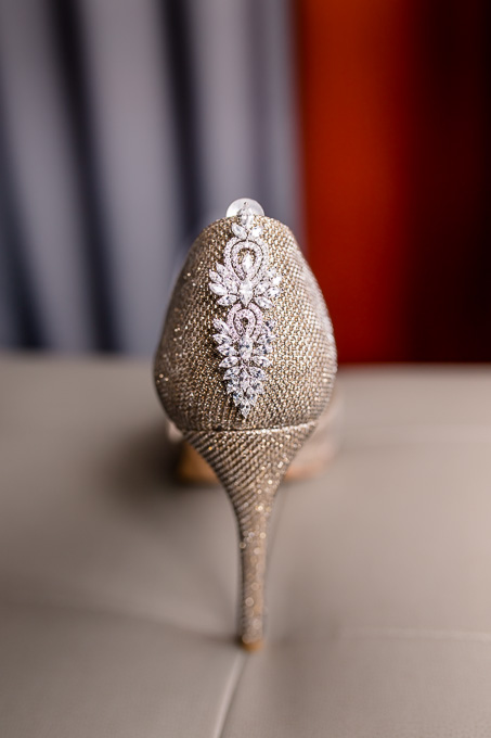 elegant bridal shoes with sparkly earrings