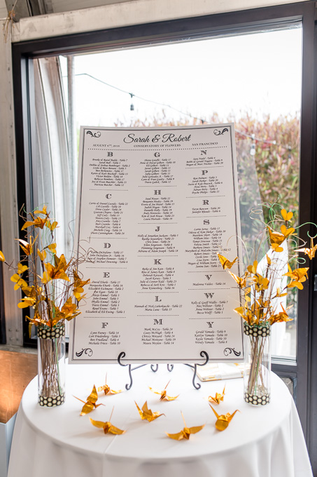 guest seating chart with golden paper cranes