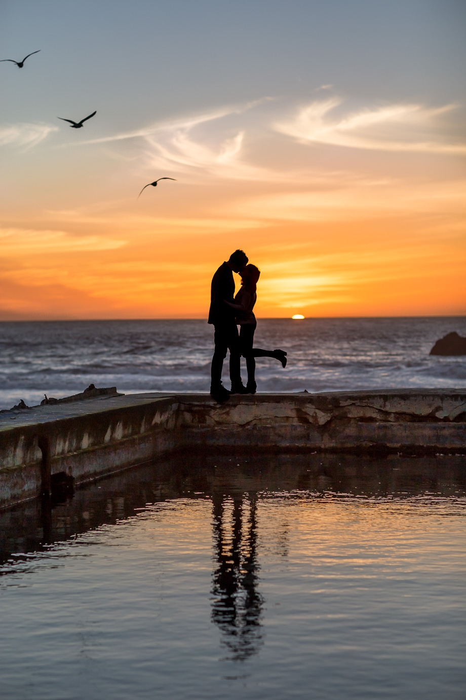 San Francisco sutro baths sunset silhouette engagement photo with seagulls