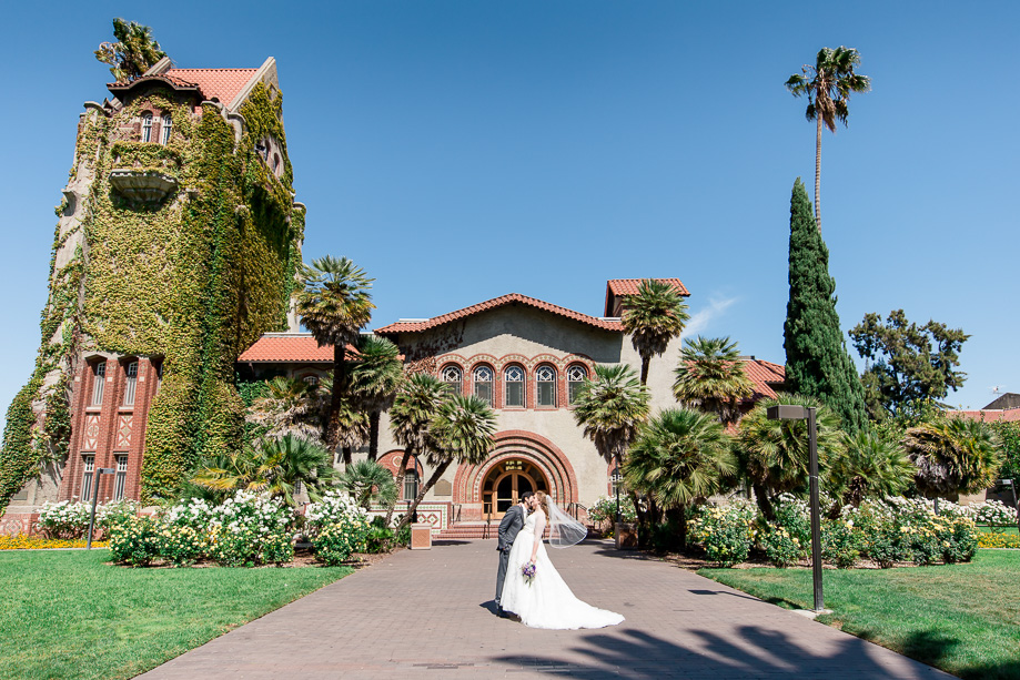 wedding portrait in front of the Tower Hall at San Jose State University
