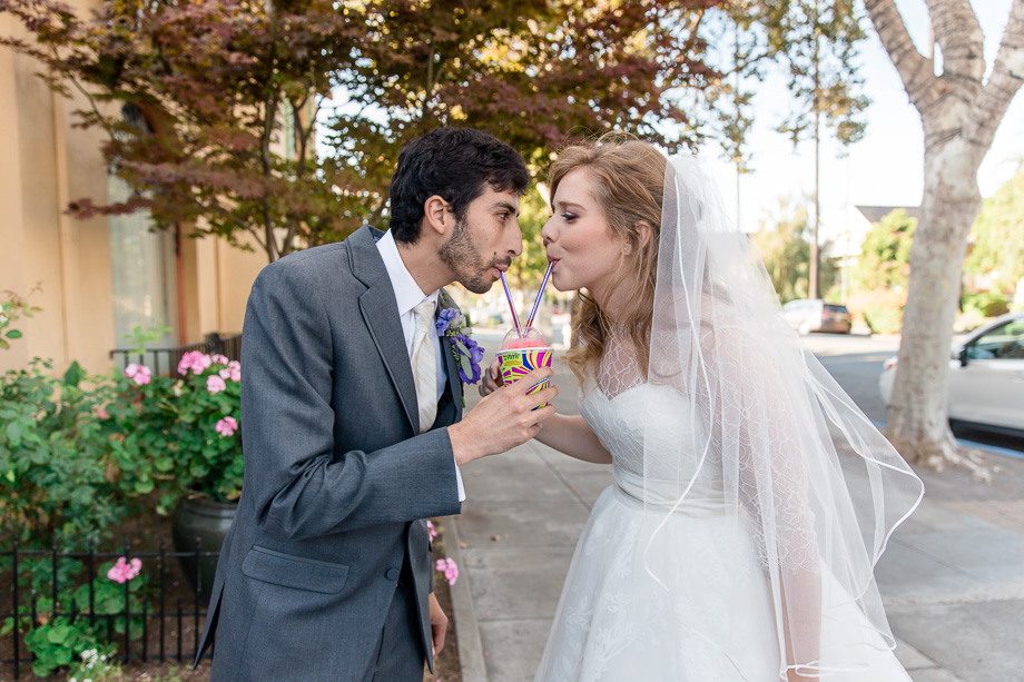 bride and groom sharing their seven eleven slurpee as newlyweds