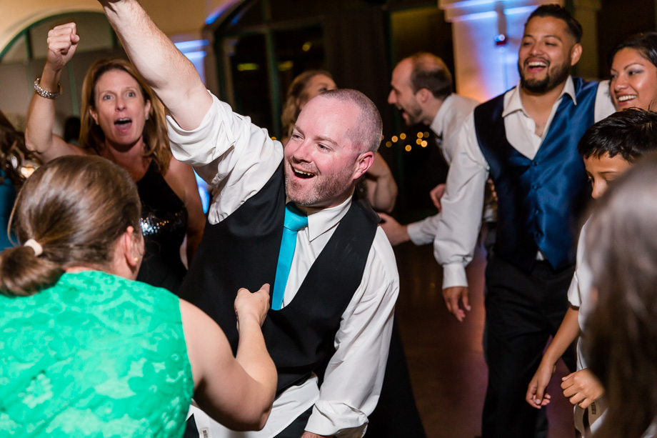 groom dancing with the guests