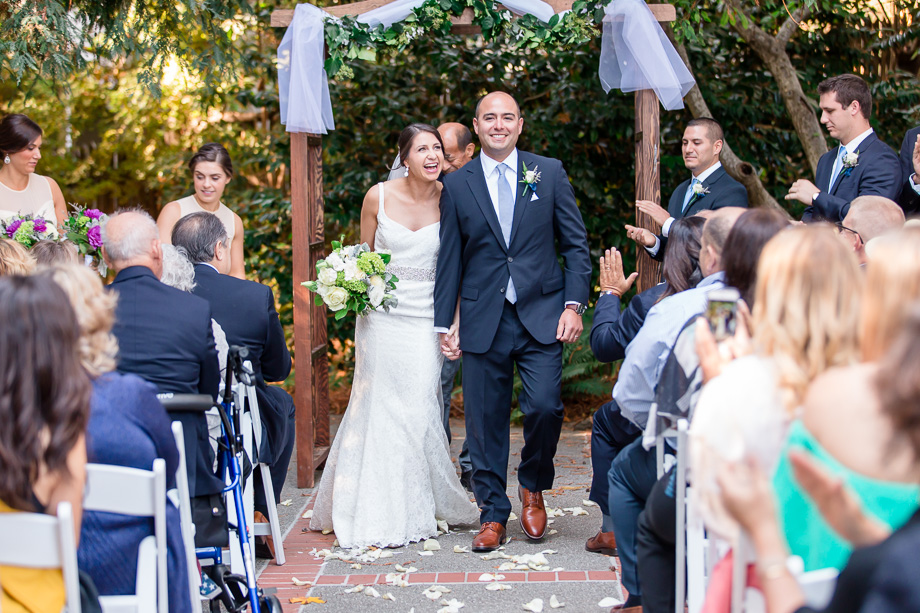 walking down the aisle as husband and wife at Mill Valley Outdoor Art Club