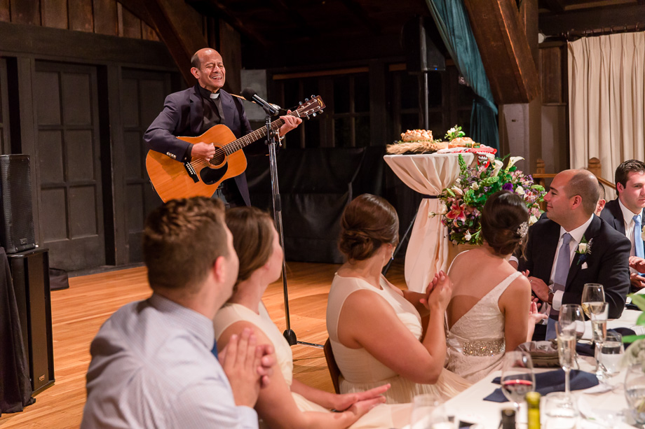 officiant singing at the wedding reception