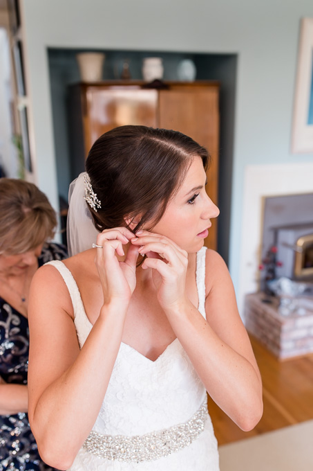bride putting on final touch ups