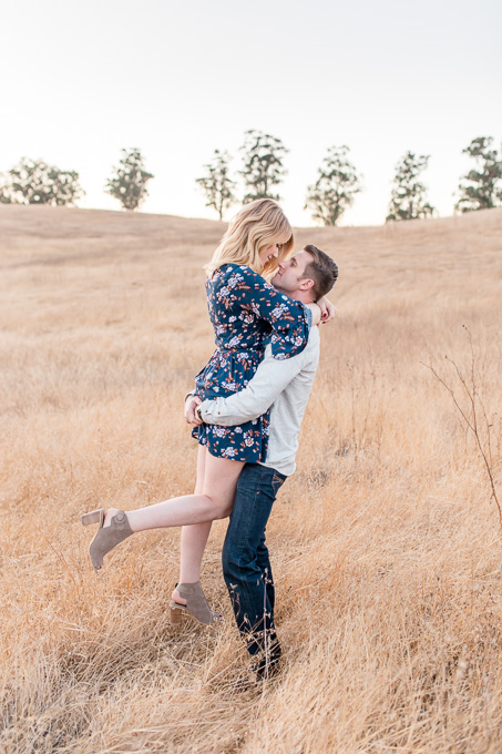 save the date photo in this open field with golden tall grass san francisco wedding photographer