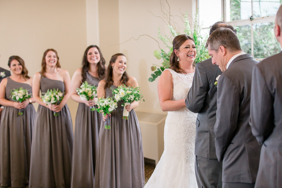 bride laughing at grooms funny vows