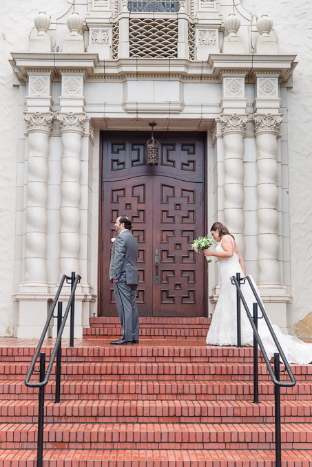 a romantic first look in front of the Presidio Chapel