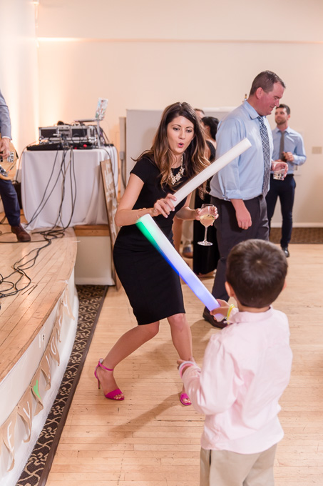 wedding guests having fun with their light sabers