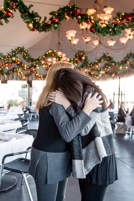 hugging her mom after the surprise proposal - she had no idea the family flew in for this special moment