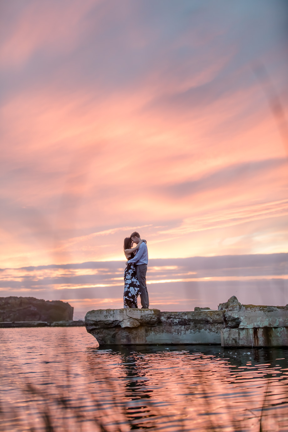 lands end sutro baths cloudy pink sunset reflection engagement picture