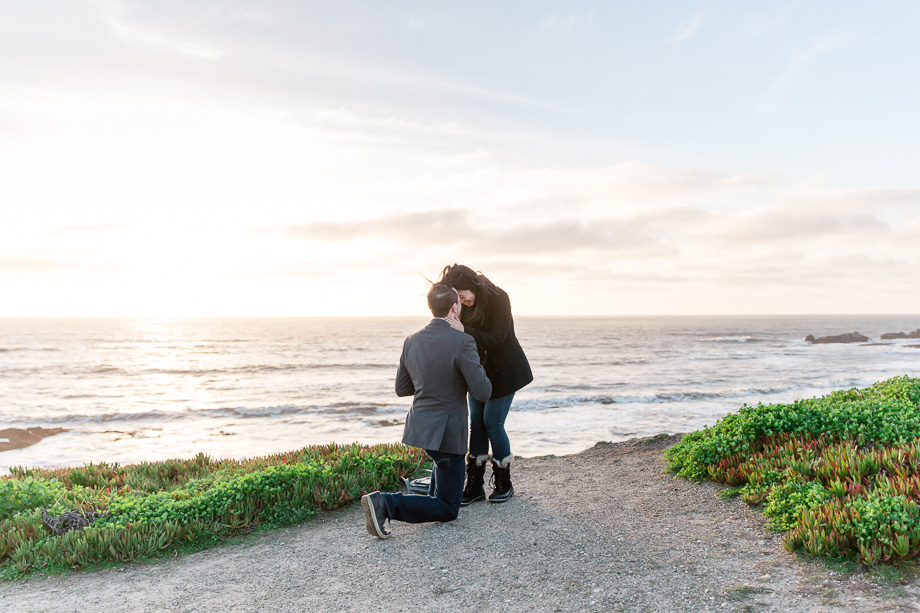 a sweet surprise marriage proposal up on a cliff overlooking the Pacific Ocean in Half Moon Bay