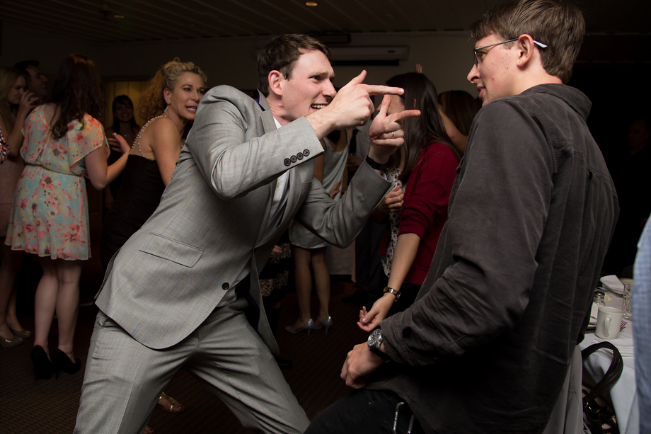 Groom dancing with his friend