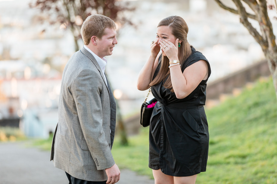 wiping tears of joy from her eyes after proposal