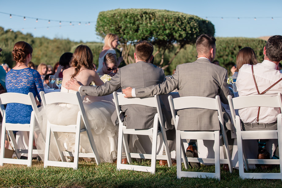 outdoor reception toast under the string lights