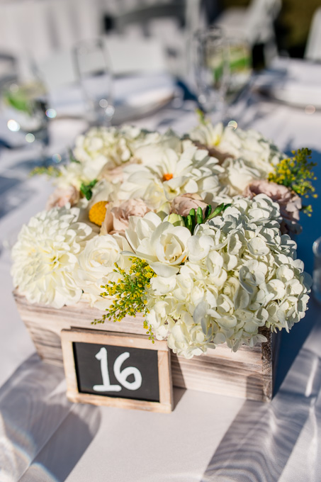 outdoor rustic floral centerpiece in a wooden box
