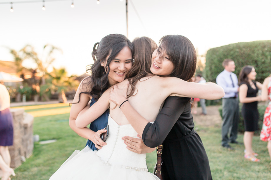 bride hugging her best friends