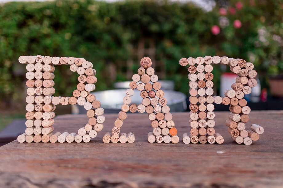 the cork bar sign handmade by bride and groom