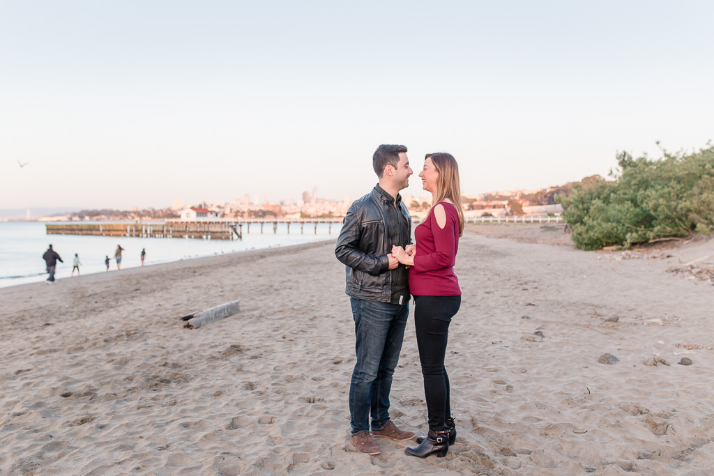 beach engagement picture with San Francisco in the background
