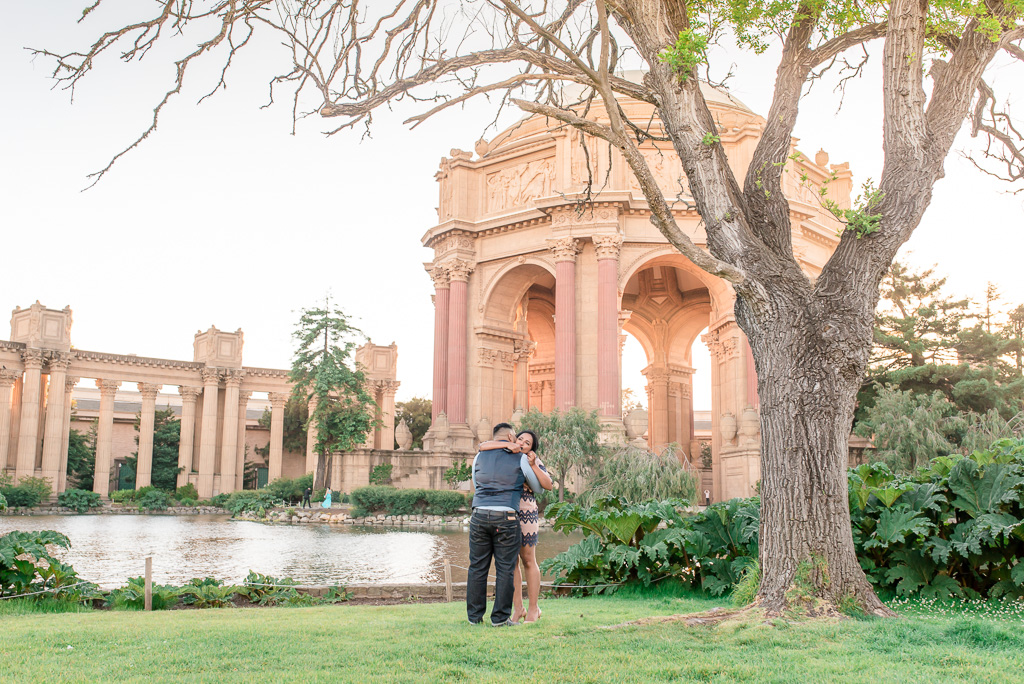 emotional moment - couple hugging at Palace of Fine Arts with the dome in the background