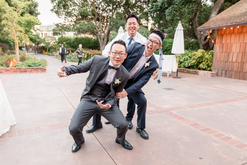 groom taking a funny photo with his friends at the Outdoor Art Club