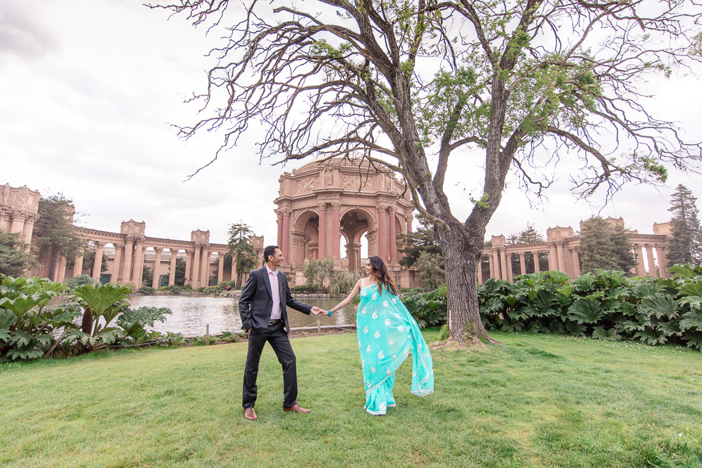engagement photo showing off sari at palace of fine arts across the lake