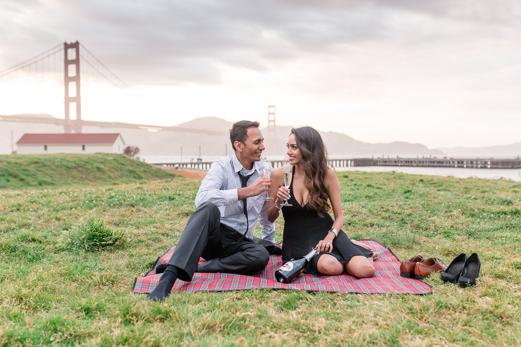 Presidio picnic themed engagement photo in front of golden gate bridge