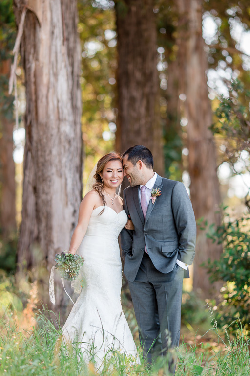 beautiful bride and groom portrait in a sunny forest