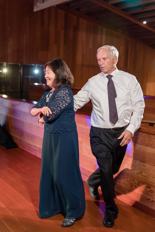 parents of the groom dancing together