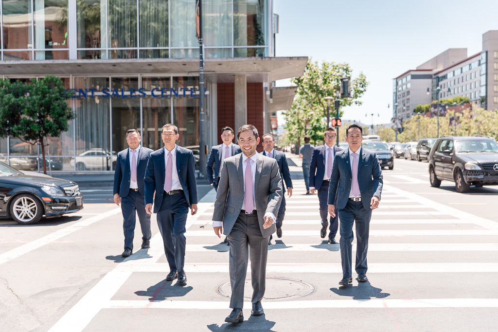 groom and groomsmen crossing a San Francisco crosswalk looking cool