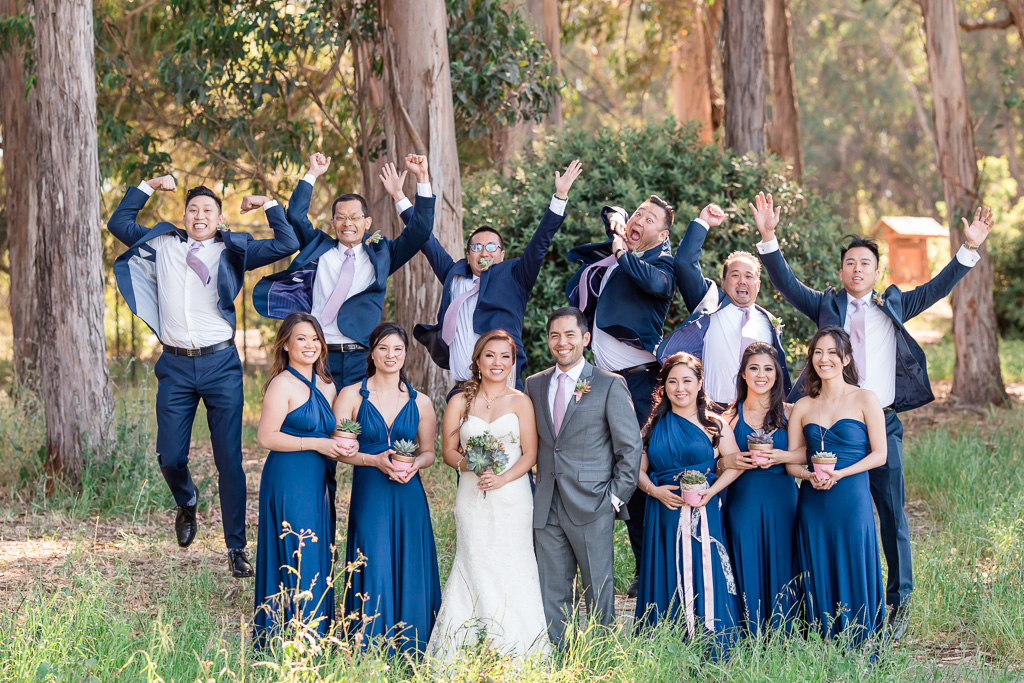 silly wedding party jumping photo with funny facial expressions