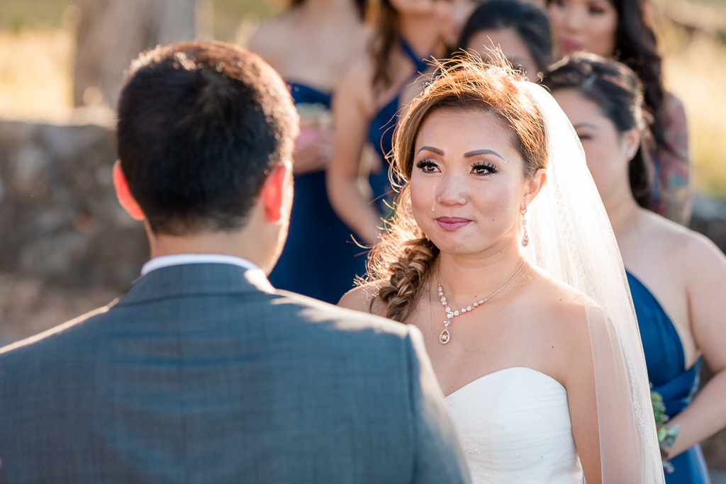 single tear rolling down bride's face during touching wedding ceremony at Coyote Point