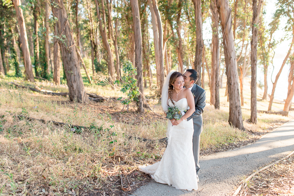 bride and groom laughing sweetly in northern California forest