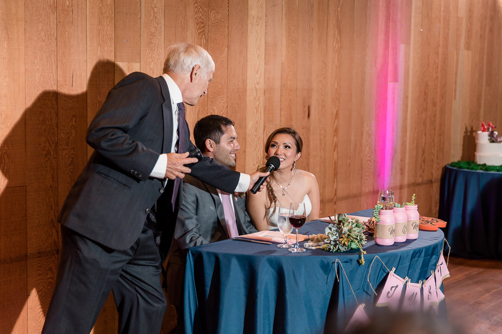 father of the groom giving toast to newlyweds