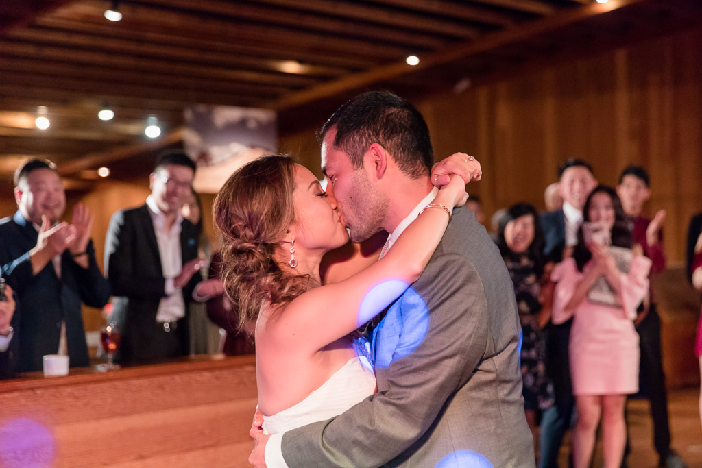 bride and groom kissing during first dance