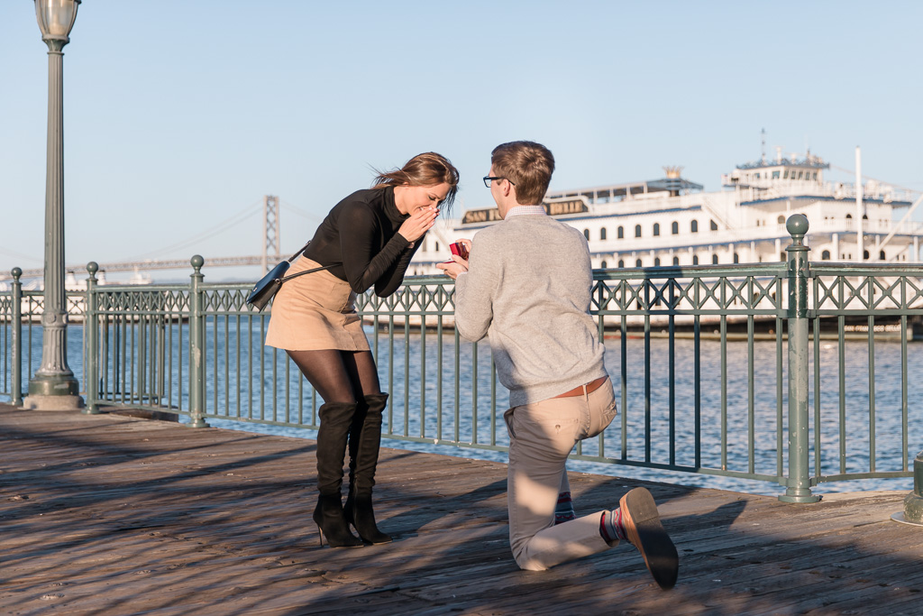 surprise proposal reaction with Oakland San Francisco Bay Bridge backdrop