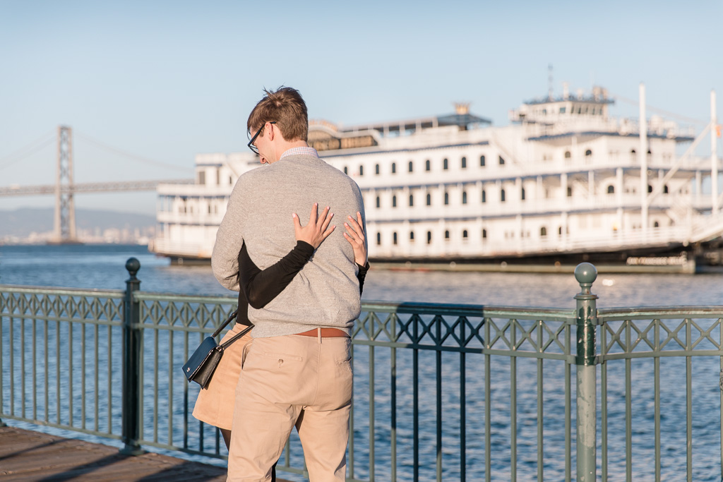 hugging on the pier after proposal