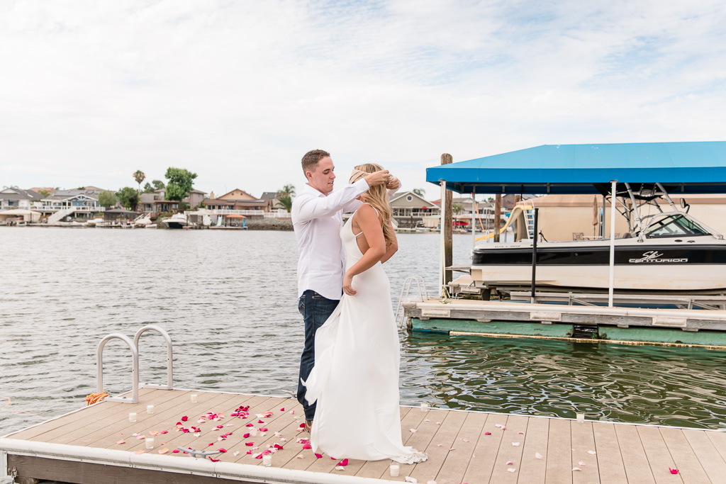 taking off blindfold on a dock and getting ready to propose