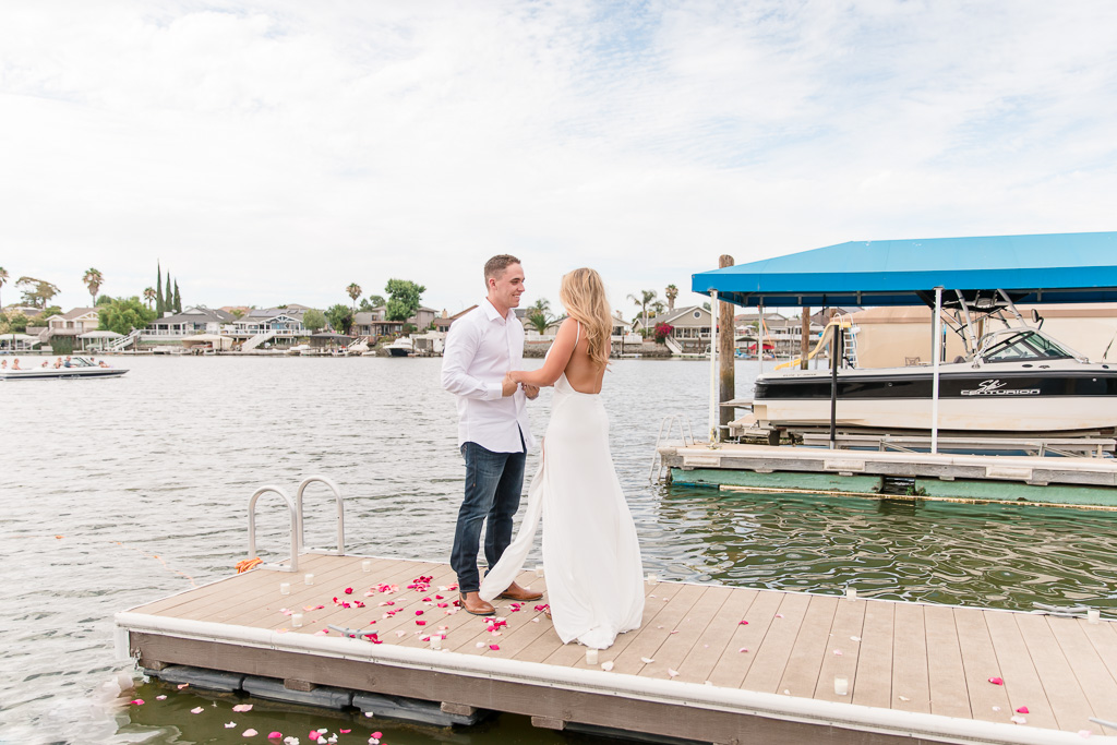 surprise proposal on a lake dock
