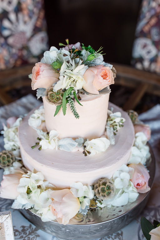blush wedding cake with fresh pink roses